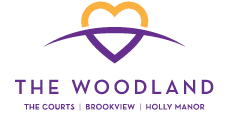 The Woodland logo features a heart with a purple and yellow outline. AI generated content