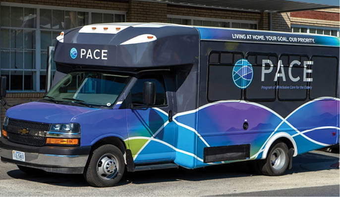 A blue and purple bus with the word “PACE" on the side is parked in a parking lot. AI generated content
