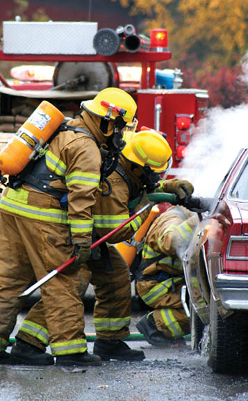 firemen with burning car