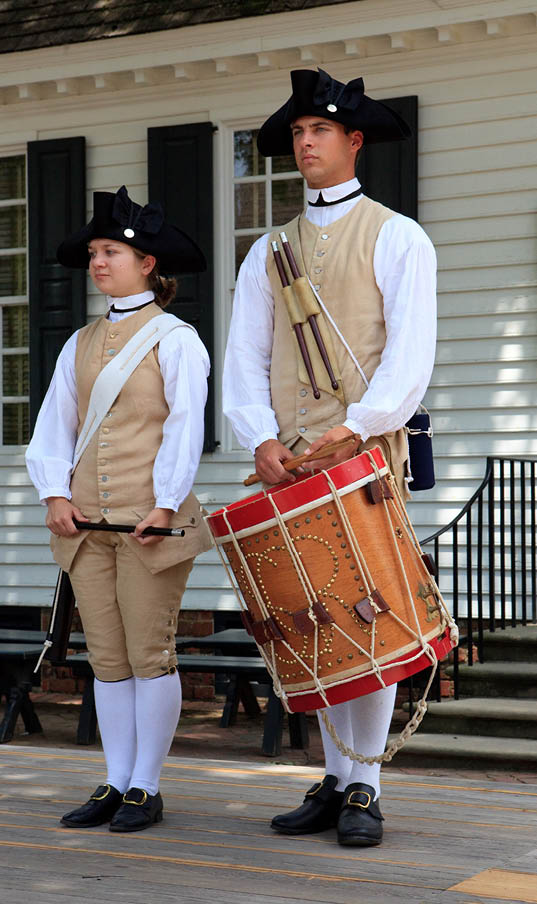 Williamsburg, Virginia - June 21, 2009. Two members of the Colonial Williamsburg Fifes and Drums Corps, stand at attention between musical numbers.