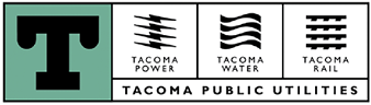 A green and white sign that says TACOMA PUBLIC UTILITIES. Description generated by AI