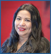 A woman with long black hair and a black shirt. Description generated by AI