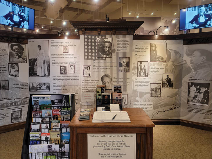 A display of photos and memorabilia is set up in a museum. AI generated content
