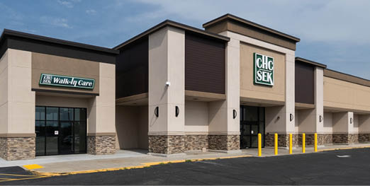 A large building with a green sign on the side. AI generated content