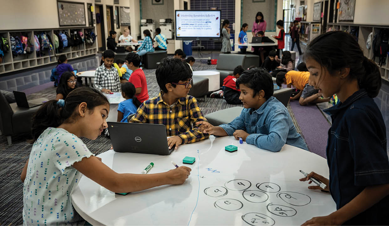 FRISCO, TEXAS - OCTOBER 26, 2023: Two fourth grade classes work together to solve a math word problem at Kenneth “Rex” Talley Elementary School - a local public school that is 88 percent Asian. The student population in Frisco ISD is now 40 percent Asian, and primarily South Asian, up from 10 percent in 2010. Frisco is a boomtown, often listed among the best places to live in the country. The city, which barely existed 30 years ago, has become a landing pad for transplants from around the country, drawn by the ‘A’ rated public school district, relatively cheap housing and the array of available jobs at companies around Dallas and Fort Worth. Frisco ISD - which prioritizes smaller schools, teaching using real life scenarios, diversity and inclusion, had sixty National Merit Scholars in 2023, amongst the highest number in the state of Texas. PHOTO: Meridith Kohut for The New York Times