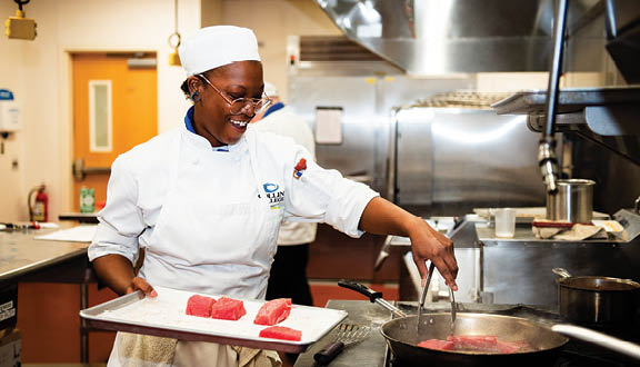 A culinary class prepares and cooks food on March 2, 2023.