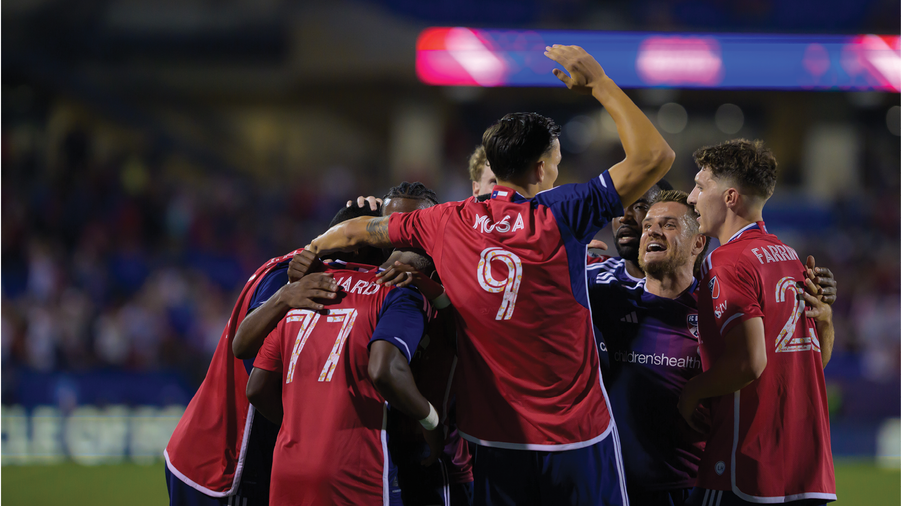 A group of men celebrating a victory on a soccer field. AI generated content
