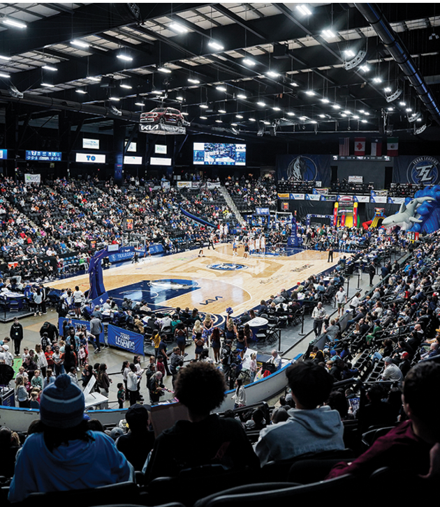 A basketball game is being played in a crowded stadium. AI generated content