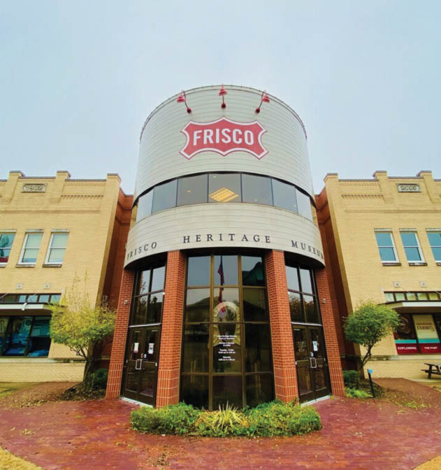 A large brick building with a large white dome on top. The building has a sign on the side that says “Frisco Heights Main Street Market." AI generated content