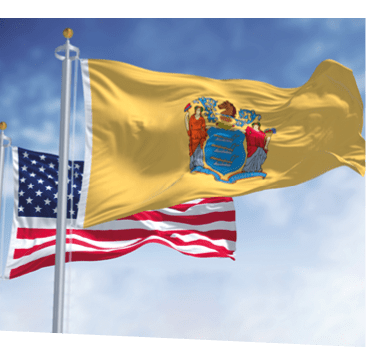 The New Jersey state flag waving along with the national flag of the United States of America. In the background there is a clear sky. New Jersey s a state in the Northeastern regions of the US