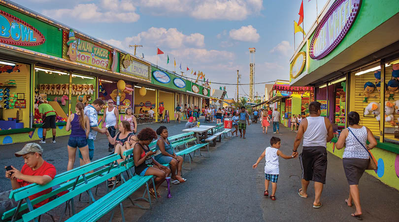 Keansburg, NJ, USA - July 17, 2017: People enjoy a walk through the stands  Keansburg Amusement Park in New Jersey.