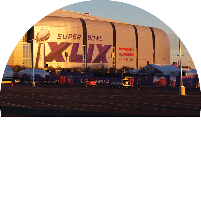 Glendale, US – January 24, 2015: Evening cast golden color on silver dome of University of Phoenix Arizona Cardinal Stadium that dressed up for Super Bowl XLIX taking place on February 1, 2015