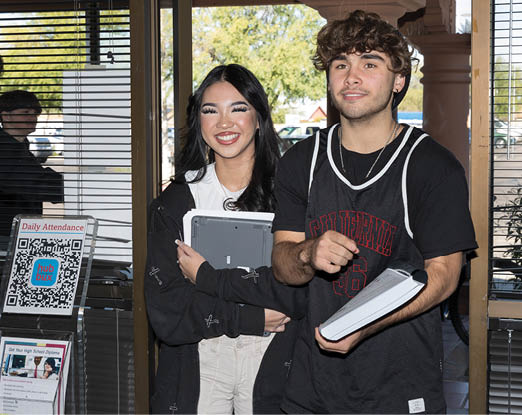 A man and woman are standing together, both holding tablets. AI generated content