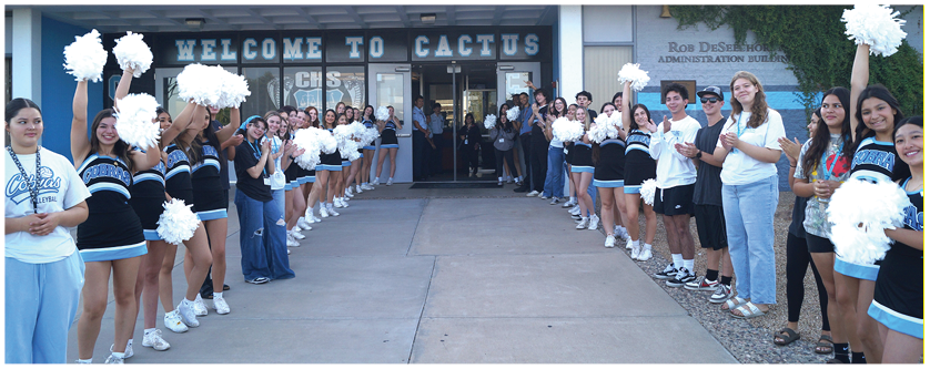 A group of cheerleaders are lined up in front of a building, holding pom poms. AI generated content