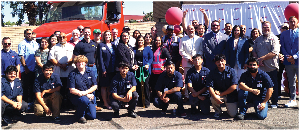 A group of people pose for a photo in front of a red truck. AI generated content
