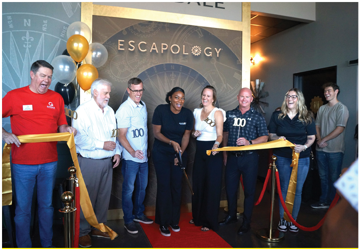 A group of people are standing in front of a ribbon, posing for a picture. They are wearing black and white shirts. AI generated content