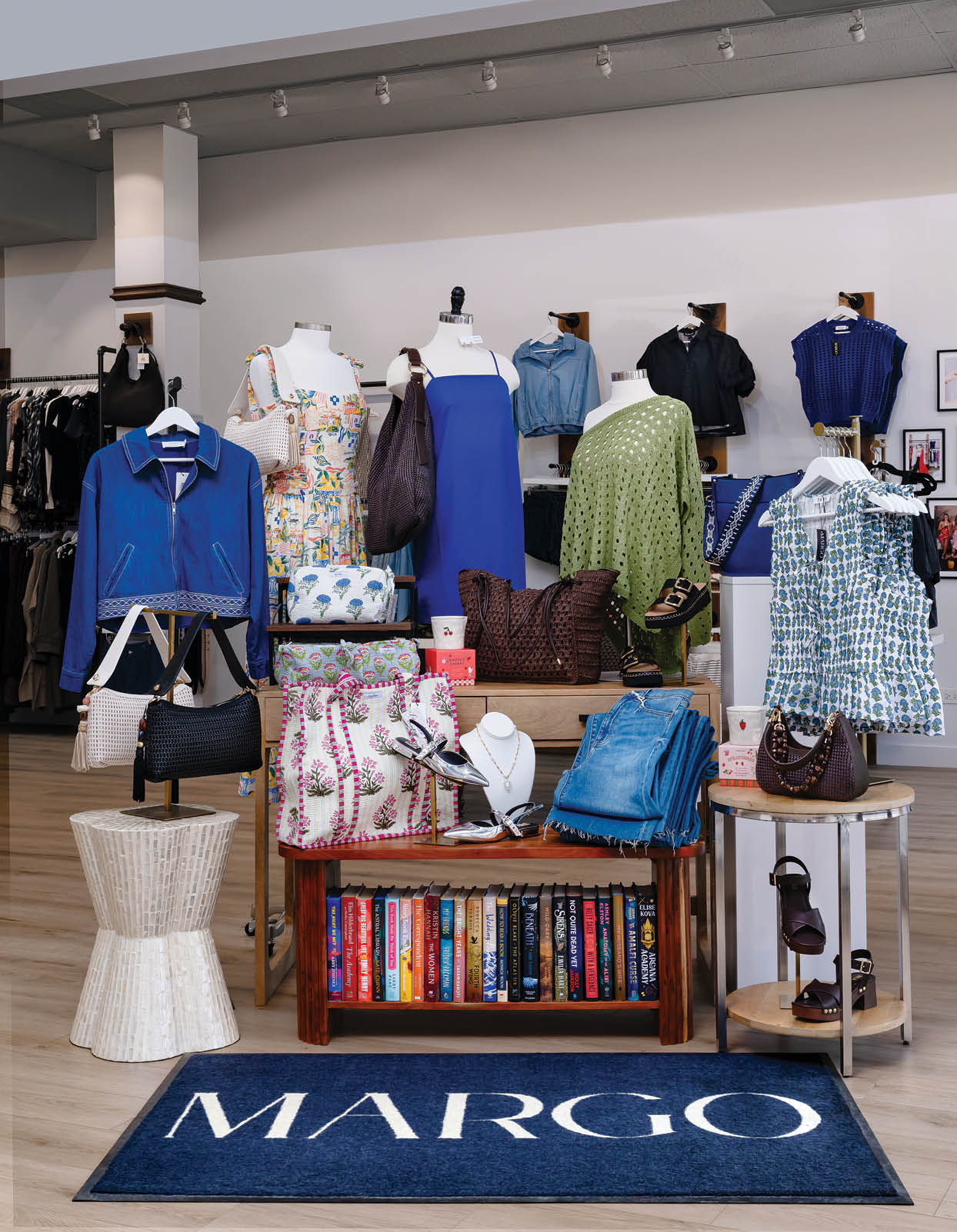 A display of clothing and accessories in a store. Description generated by AI