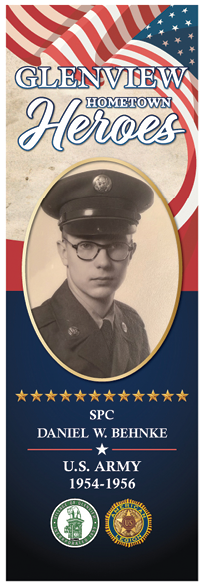 A man in a military uniform is pictured on a poster. Description generated by AI