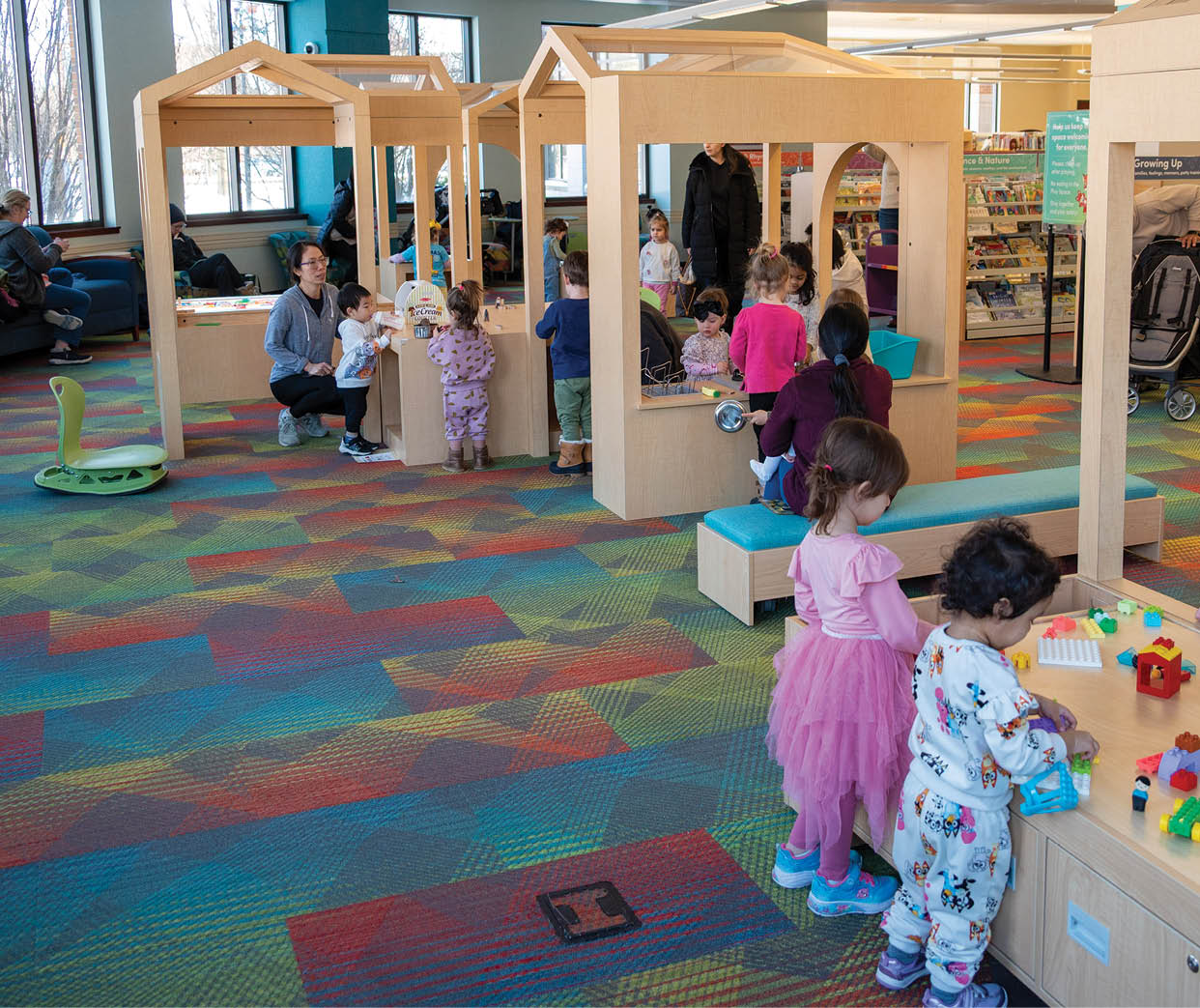 A group of children playing in a playroom. Description generated by AI