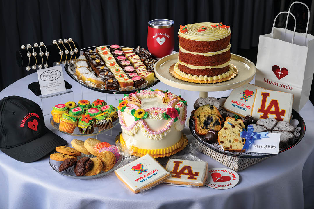 A table with a cake and cupcakes on it. Description generated by AI