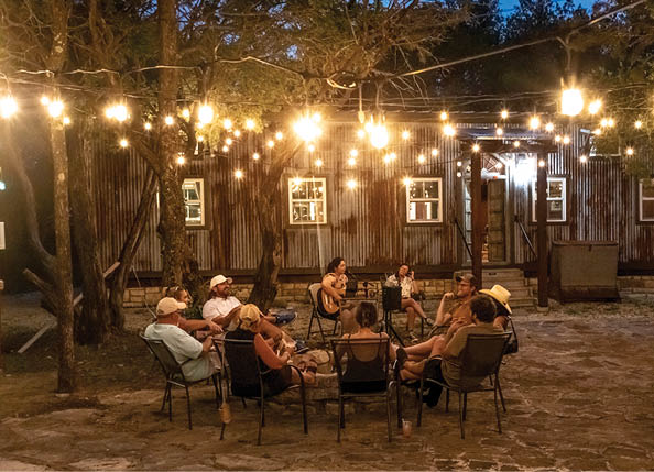 Sledge Distillery - Tolar, TX. Patio with live music at the speakeasy