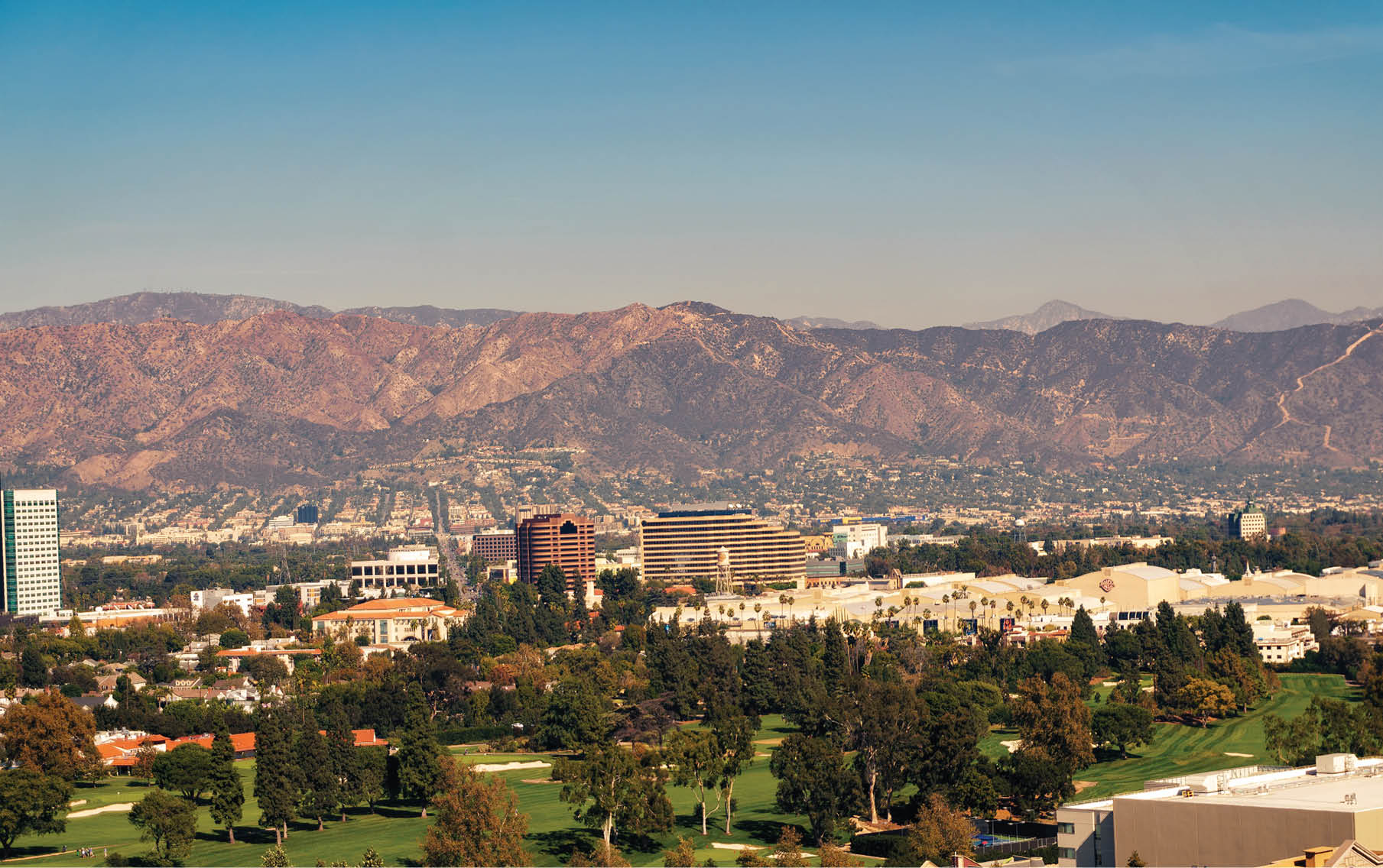 Los Angeles, California, USA - October 28, 2018: View over the San Fernando Valley overlooking Universal Studios Hollywood, Warner Bros and Disney Studios with Verdugo Mountains in the background.