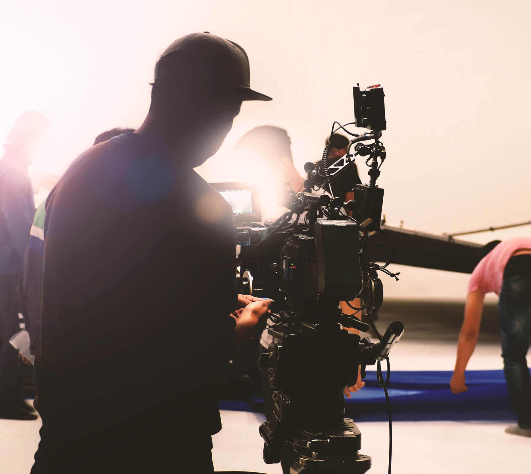 Video camera in film or movie production on tripod and professional gear which shooting in location or studio with crew team and beautiful prop or set and ready to online live broadcast or tv on air later