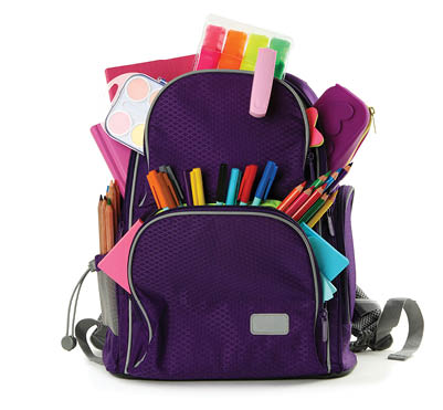 Purple backpack with different school stationery on white background