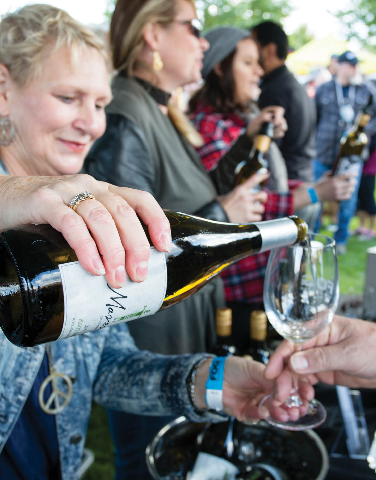 October 1, 2017 - Oliver, British Columbia, Canada: Visting attendees celebrating at the annual Festival of the Grape located in Oliver, British Columbia, Canada. The Grape Stomp is one of the popular events.