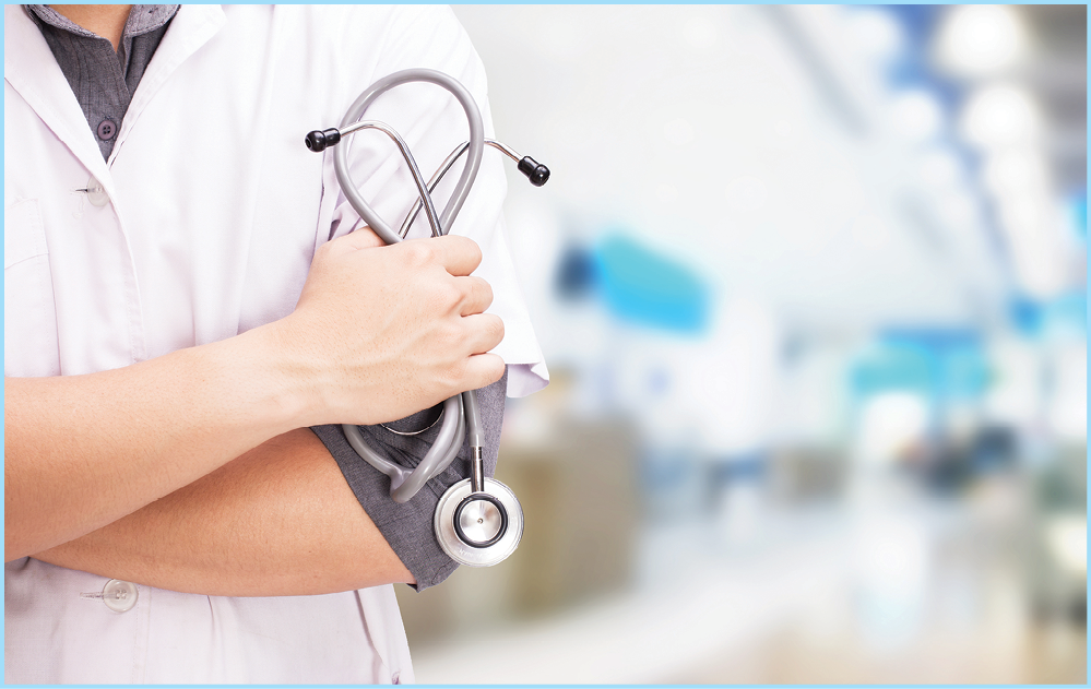 Doctor with a stethoscope in the hands and hospital background.