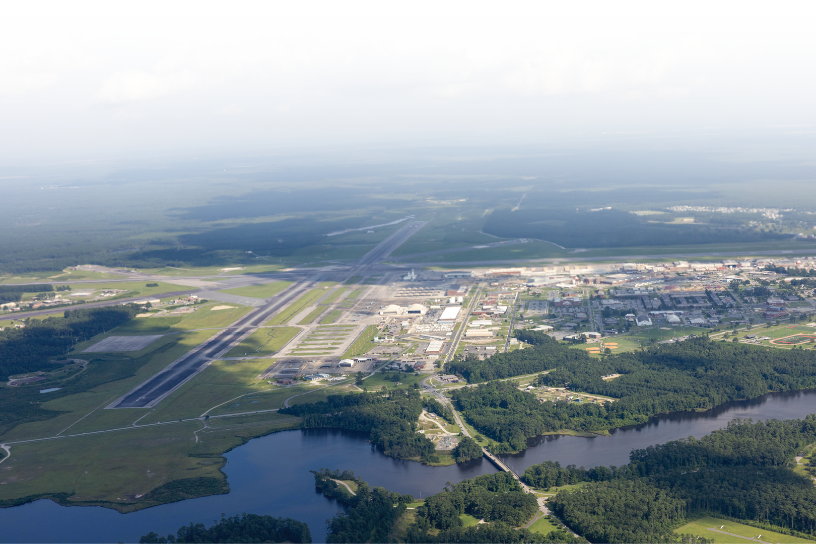 An aerial picture of Marine Corps Air Station Cherry Point (MCAS), North Carolina, taken from a KC-130J Super Hercules assigned to Marine Aerial Refueler Transport Squadron 252, 2nd Marine Aircraft Wing, July 11, 2023. Historical aerial photographs of MCAS Cherry Point are captured to showcase the development and expansion of the installation over the years. (U.S. Marine Corps photo by Lance Cpl. Lauralle Walker)