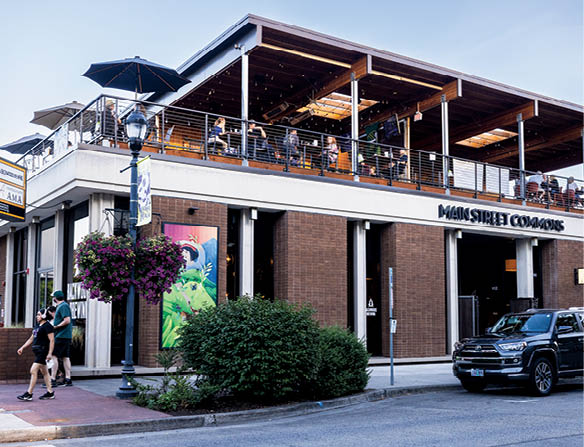 A restaurant with a large patio. Description generated by AI