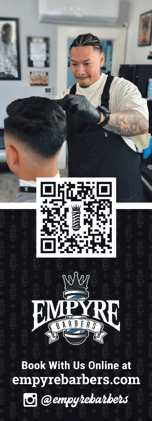 A man cutting a boy's hair. Description generated by AI