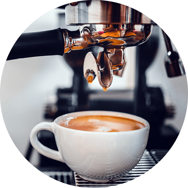Coffee extraction from the coffee machine with a portafilter pouring coffee into a cup,Espresso poruing from coffee machine at coffee shop