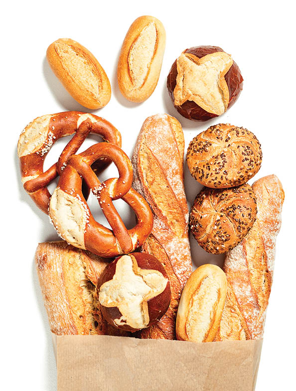 Food background. Healthy bread assortment in paper bag , copy space, banner. Shopping food supermarket and bread concept.