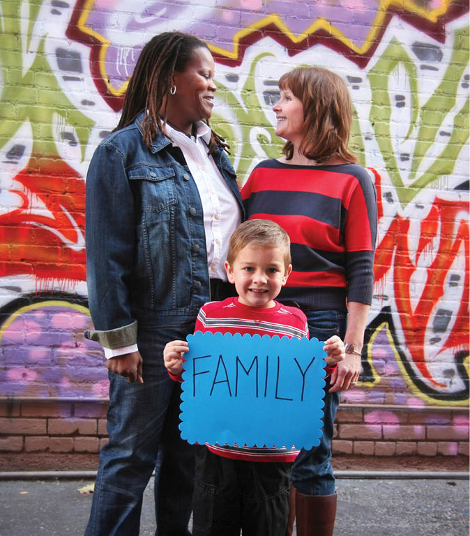 a cute family holding a sign that read family