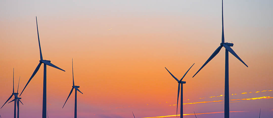 Kansas Wind Farm with agriculture at sunset in Pratt, KS, United States