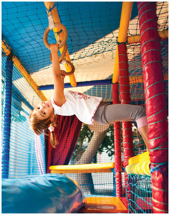Little girl playing in playground