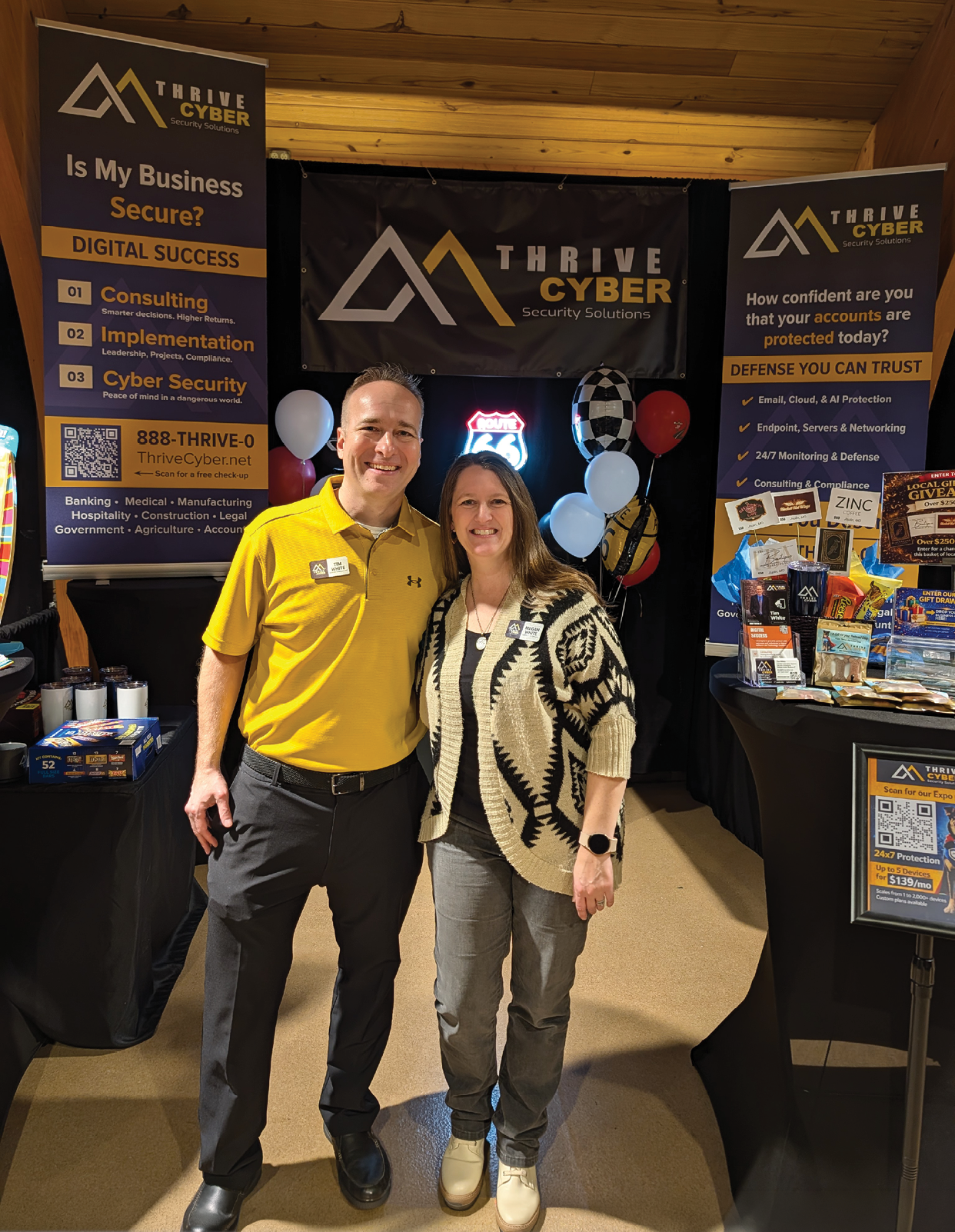 A man and woman pose for a picture in front of a banner. AI generated content