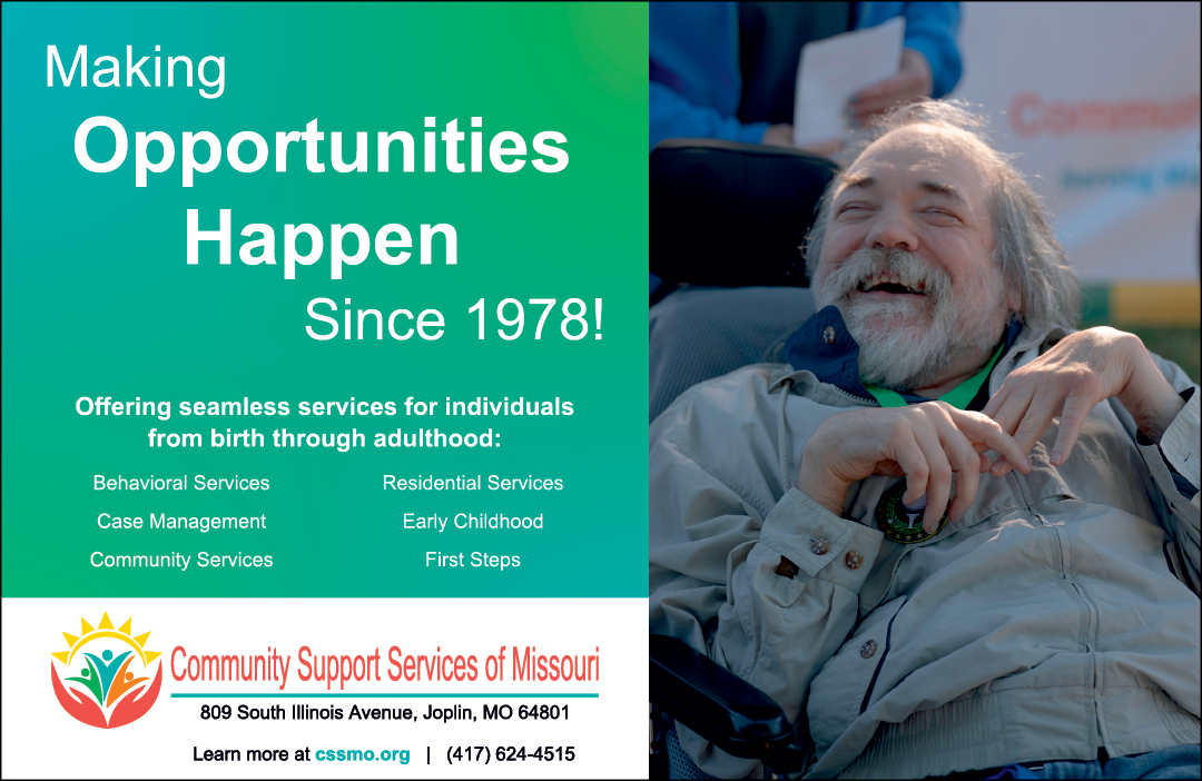 A man is sitting in a chair and smiling. He is holding a cigarette in his hand. The man is wearing a jacket and a green shirt. AI generated content