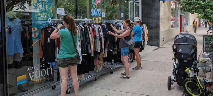 A group of people are shopping at a store. Description generated by AI