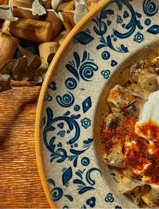 A plate of food with a blue and white plate. Description generated by AI
