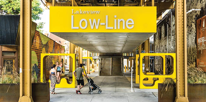 A yellow sign with the word “Lowell" on it. Description generated by AI