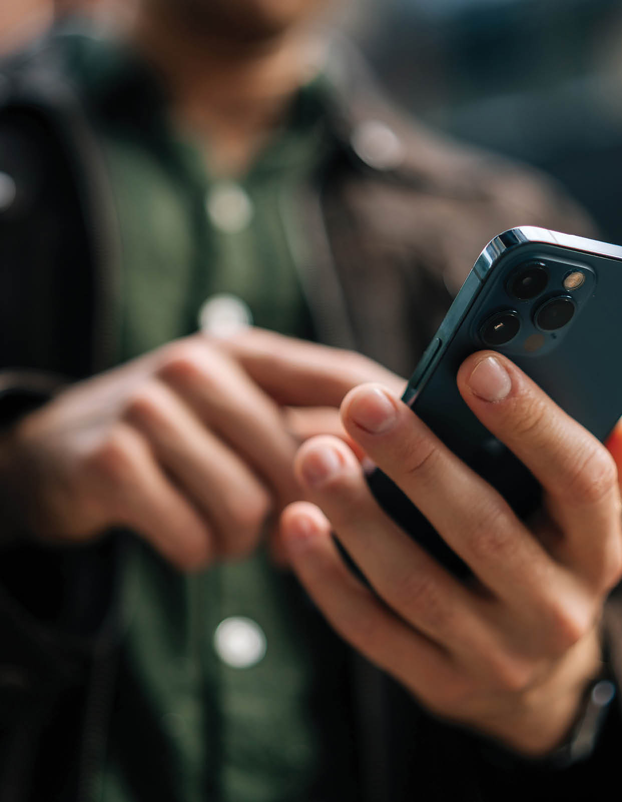 A man is holding a cell phone in his hand. AI generated content