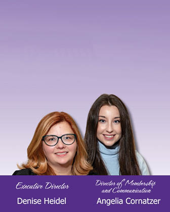 Two women are smiling for a photo. One is wearing glasses and a blue shirt. AI generated content