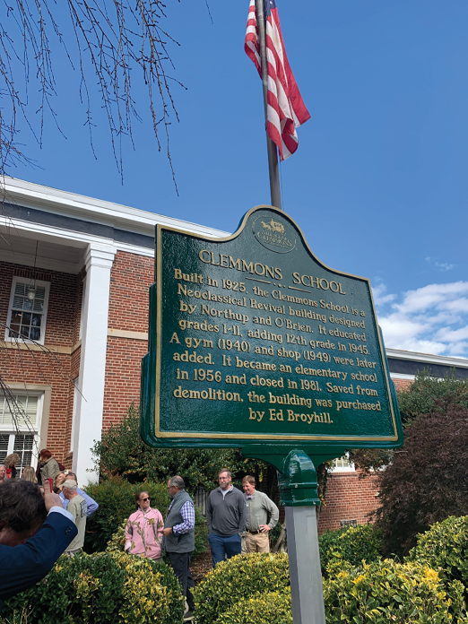 A green sign with white text commemorating the birthplace of the first president of the United States. AI generated content