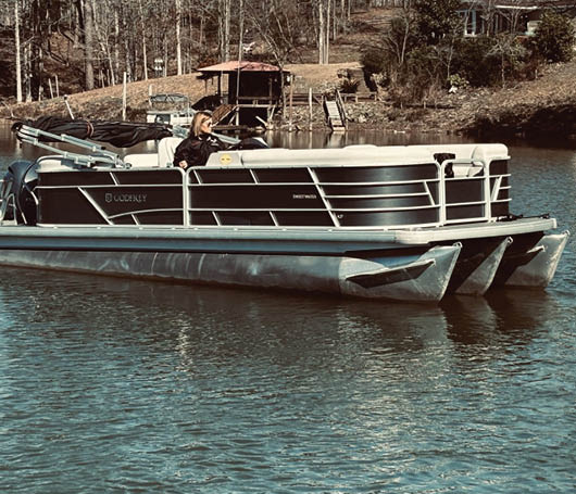 A boat is on the water. Description generated by AI