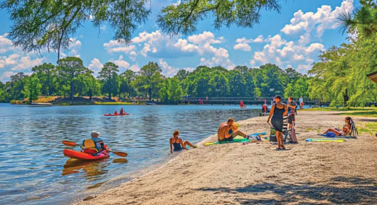 A group of people are at the beach, some are in the water and others are on the shore. Description generated by AI