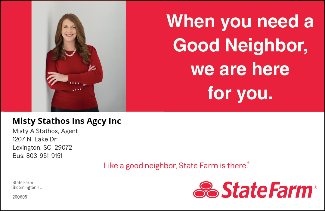 A woman in a red shirt is smiling and holding her arms out. Description generated by AI