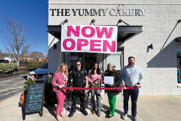The Yummy Caterer is now open. Description generated by AI